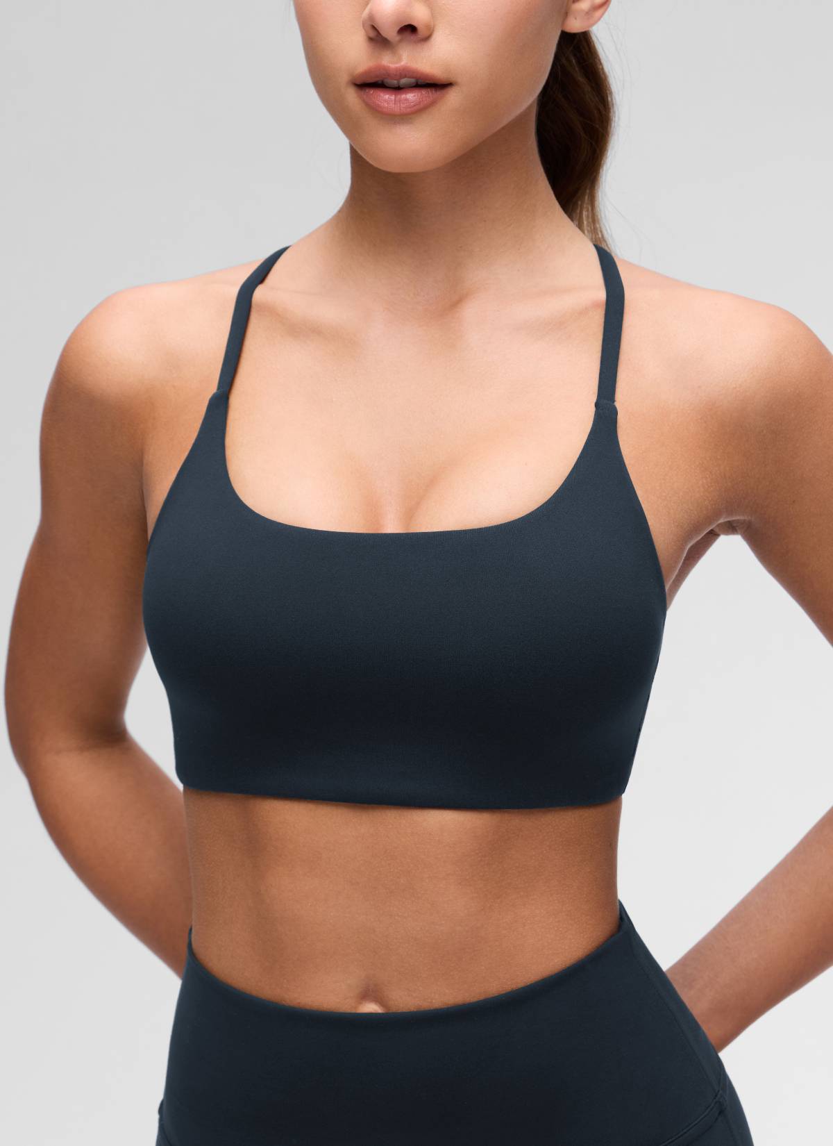 CRZ YOGA Women's Butterluxe Yoga Scoop Neck Twist Cross Back Sport Bra True Navy @model_info:Maria