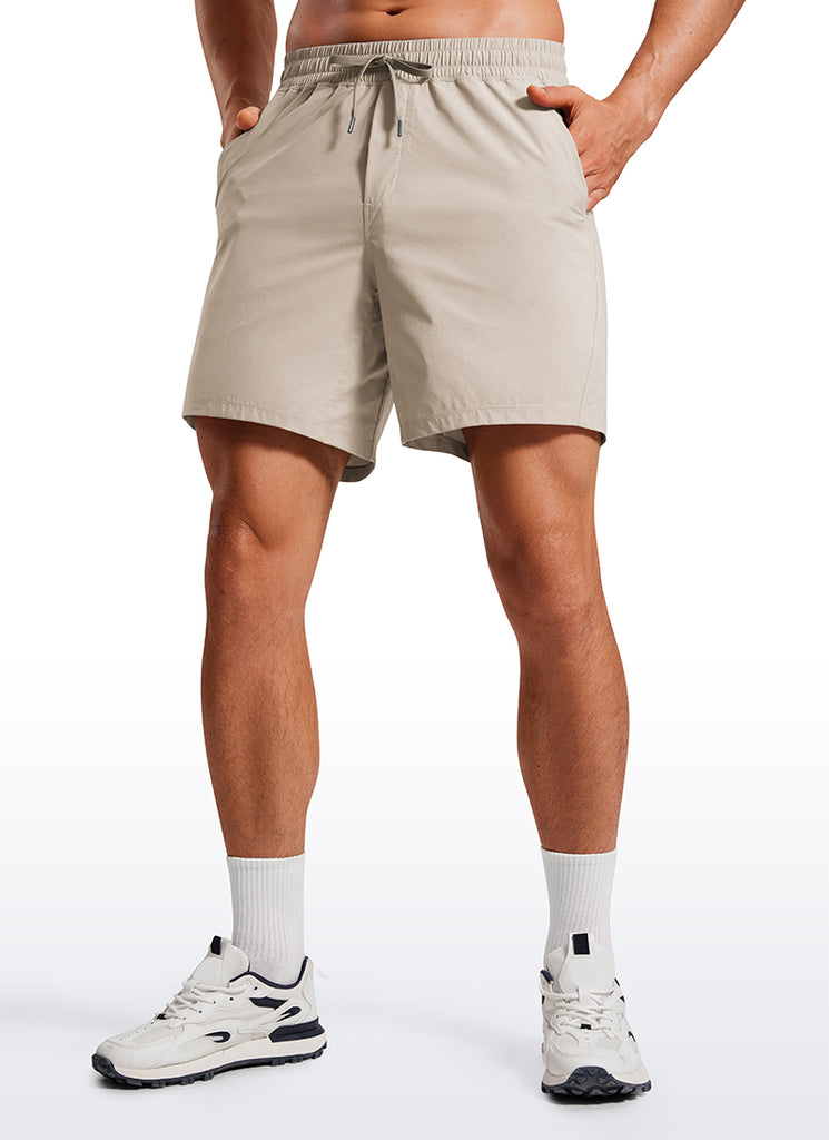 CRZ YOGA Men's Training Quick Dry Pocketed Linerless Shorts 7'' True Navy