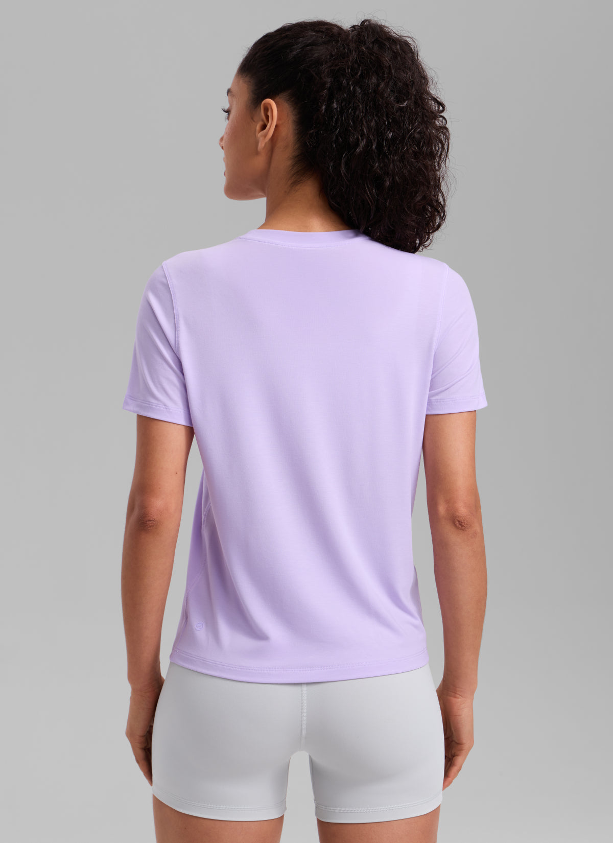 CRZ YOGA Women's Quick Dry Workout Crewneck Hip Length Short Sleeve Lavender Frost @model_info:Larissa