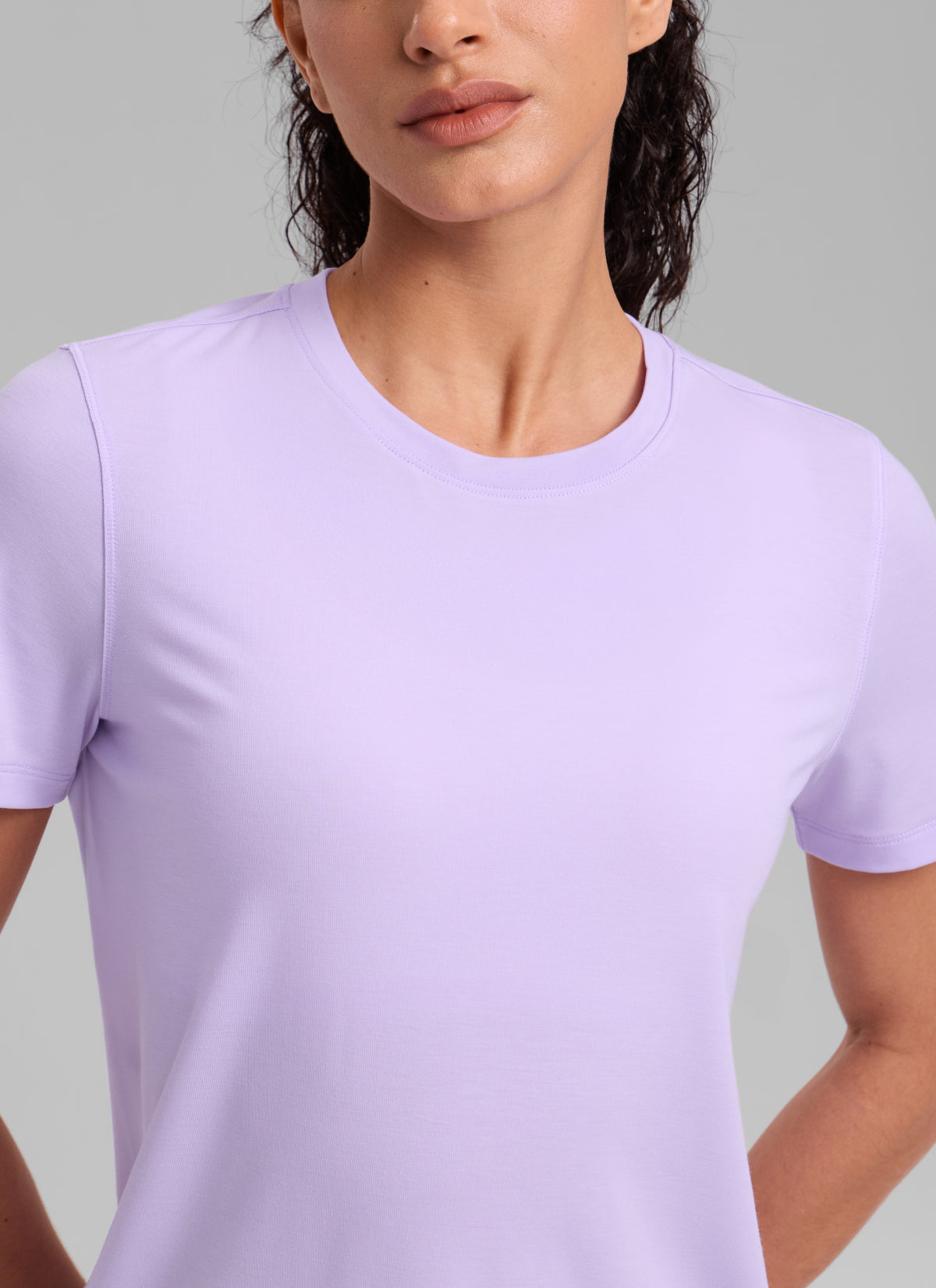 CRZ YOGA Women's Quick Dry Workout Crewneck Hip Length Short Sleeve Lavender Frost @model_info:Larissa