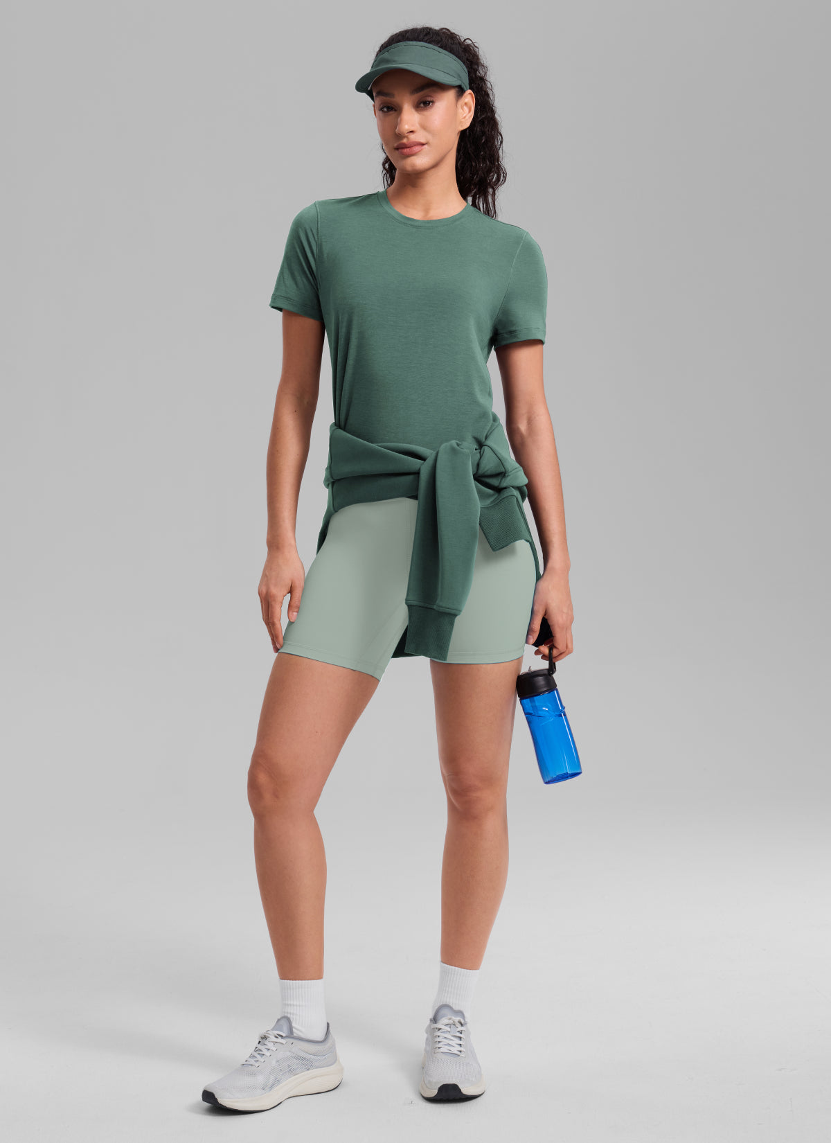 CRZ YOGA Women's Quick Dry Workout Crewneck Hip Length Short Sleeve Graphite Green @model_info:Larissa