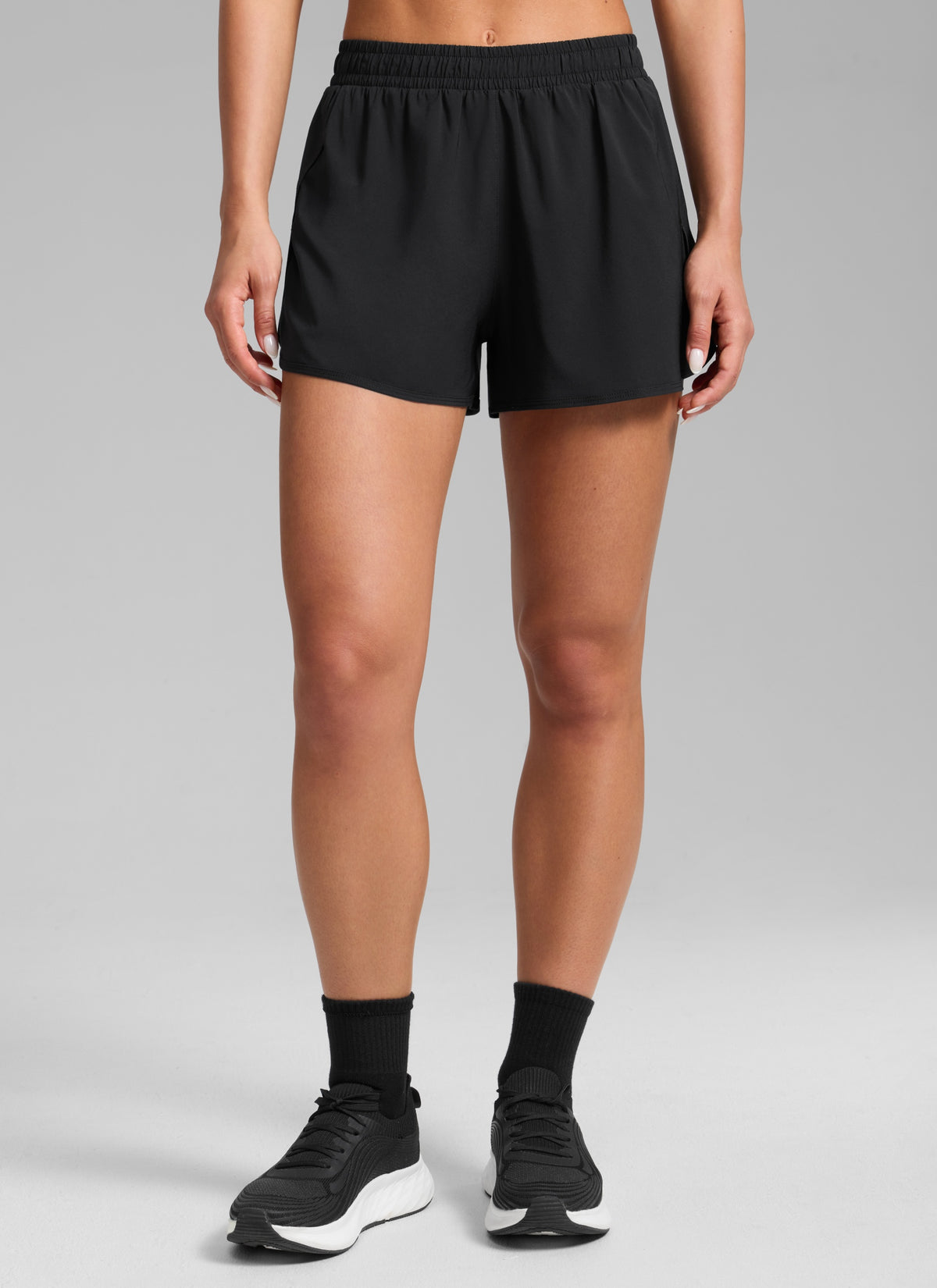 CRZ YOGA Women's Feathery-Fit Soft Workout Mid Rise Split Shorts 2.5'' Black @model_info:Isidora